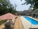 Inviting backyard with a large pool, spacious deck, and comfortable seating area at 640 Fox Hollow Rd., Murrells Inlet, SC 29576