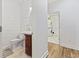 Cozy half bath with shiplap walls, a vanity, and a toilet at 640 Fox Hollow Rd., Murrells Inlet, SC 29576