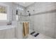 Bright bathroom featuring a glass enclosed shower, neutral tones, and tiled walls at 640 Fox Hollow Rd., Murrells Inlet, SC 29576