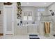 Spa-like bathroom with a tub, shower, neutral color palette, and wood-look accents at 640 Fox Hollow Rd., Murrells Inlet, SC 29576