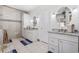 Bright bathroom features double sinks, white cabinets, stone countertops and decorative tile at 640 Fox Hollow Rd., Murrells Inlet, SC 29576
