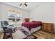 Charming bedroom with wood-look floors, a large window, and comfortable seating at 640 Fox Hollow Rd., Murrells Inlet, SC 29576