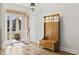Welcoming foyer with wood flooring, coat rack with mirror, and a view of the front porch at 640 Fox Hollow Rd., Murrells Inlet, SC 29576