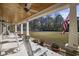Relaxing front porch with ceiling fans, rocking chairs and stone accents, perfect for enjoying the outdoors at 640 Fox Hollow Rd., Murrells Inlet, SC 29576