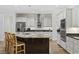 Island kitchen with granite countertops, stainless steel appliances, and a decorative tile backsplash at 640 Fox Hollow Rd., Murrells Inlet, SC 29576
