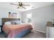 Spacious bedroom with ceiling fan, large bed, and dresser at 707 Rose Dr., Myrtle Beach, SC 29588