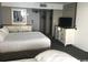 Comfortable bedroom featuring a dresser, mirror and a television at 7100 N Ocean Blvd. # 1608, Myrtle Beach, SC 29572
