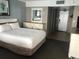 Bright bedroom with a large bed and a mirrored dresser providing ample storage at 7100 N Ocean Blvd. # 1608, Myrtle Beach, SC 29572