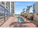 Relax by the pool with a jacuzzi, palm trees, and sunny skies at 7100 N Ocean Blvd. # 1608, Myrtle Beach, SC 29572