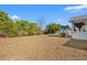 Backyard with patio furniture and a view of a pond and lush landscaping at 773 Drawbridge Dr., Conway, SC 29526