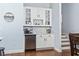 Wet bar with glass-front cabinets and marble countertop at 812 Shine Ave. # 812, Myrtle Beach, SC 29577