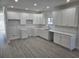 Modern kitchen featuring white shaker cabinets and quartz countertops at 1003 28Th Ave. S, North Myrtle Beach, SC 29582