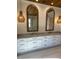 Elegant bathroom with double vanity, large mirrors, and modern light fixtures at 101 Green Lake Dr., Myrtle Beach, SC 29572