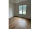 Bright bedroom with hardwood floors and a large window at 101 Green Lake Dr., Myrtle Beach, SC 29572