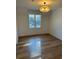 Bright bedroom with hardwood floors and a large window at 101 Green Lake Dr., Myrtle Beach, SC 29572