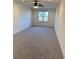 Spacious bedroom with carpeted floor and large window at 101 Green Lake Dr., Myrtle Beach, SC 29572