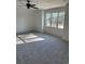 Sunlit bedroom featuring carpeted floor and ceiling fan at 101 Green Lake Dr., Myrtle Beach, SC 29572
