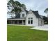 View of the back of the house with a large covered patio at 101 Green Lake Dr., Myrtle Beach, SC 29572