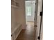 Light-filled hallway with built-in bench seating and hardwood floors at 101 Green Lake Dr., Myrtle Beach, SC 29572