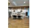 Modern kitchen with white cabinets, marble countertops, and island at 101 Green Lake Dr., Myrtle Beach, SC 29572