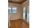 Sunroom with hardwood floors, French doors, and water views at 101 Green Lake Dr., Myrtle Beach, SC 29572