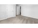 Empty bedroom with carpeted floors and white doors at 1112 Cherrystone Loop, Conway, SC 29526