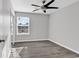 Bright bedroom with ceiling fan, window, and laminate wood floor at 116 Brentwood Dr. # E, Murrells Inlet, SC 29576