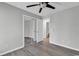 Bedroom with mirrored closet doors and access to a full bath at 116 Brentwood Dr. # E, Murrells Inlet, SC 29576