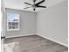 Bright bedroom with large window and ceiling fan at 116 Brentwood Dr. # E, Murrells Inlet, SC 29576