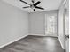 Spacious bedroom with ceiling fan and private access to a balcony at 116 Brentwood Dr. # E, Murrells Inlet, SC 29576