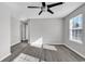 Bedroom with ceiling fan, window and access to hallway at 116 Brentwood Dr. # E, Murrells Inlet, SC 29576