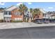 Brick and beige multi-unit building with ample parking at 116 Brentwood Dr. # E, Murrells Inlet, SC 29576