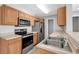 Modern kitchen featuring stainless steel appliances and light wood cabinets at 116 Brentwood Dr. # E, Murrells Inlet, SC 29576