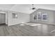 Open living room with high ceilings and grey vinyl flooring at 116 Brentwood Dr. # E, Murrells Inlet, SC 29576