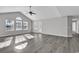 Spacious living room with vaulted ceiling and grey vinyl flooring at 116 Brentwood Dr. # E, Murrells Inlet, SC 29576