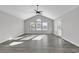 Bright living room featuring vaulted ceilings and grey flooring at 116 Brentwood Dr. # E, Murrells Inlet, SC 29576