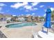 Community pool with lounge chairs and patio furniture at 116 Brentwood Dr. # E, Murrells Inlet, SC 29576