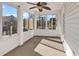 Bright screened porch with ceiling fan, perfect for relaxing at 116 Brentwood Dr. # E, Murrells Inlet, SC 29576