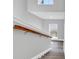 Elegant staircase with a wood handrail and gray walls at 116 Brentwood Dr. # E, Murrells Inlet, SC 29576