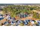 Aerial view of a neighborhood surrounded by lush trees, with a river in the distance at 122 Robert Conway Ct., Georgetown, SC 29440