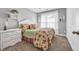 Bedroom with white wicker furniture and floral bedding at 122 Robert Conway Ct., Georgetown, SC 29440