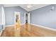 Serene bedroom with hardwood floors and access to the bathroom at 1401 Reid Ct., Myrtle Beach, SC 29588