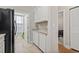 Kitchen boasts granite countertops, white cabinets, and black appliances at 157 Ella Kinley Circle # 303, Myrtle Beach, SC 29588