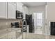 Modern kitchen with granite countertops and stainless steel appliances at 157 Ella Kinley Circle # 303, Myrtle Beach, SC 29588