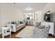 Open living room with kitchen bar and hardwood floors at 157 Ella Kinley Circle # 303, Myrtle Beach, SC 29588