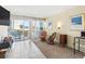 Living room with tiled floors, balcony access, and comfortable seating at 1600 S Ocean Blvd. # 312, Myrtle Beach, SC 29577