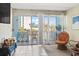 Living room with ocean view, comfy chairs, and access to balcony at 1600 S Ocean Blvd. # 312, Myrtle Beach, SC 29577