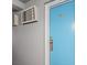 Light blue room door with a number plate and wall-mounted AC unit at 1600 S Ocean Blvd. # 312, Myrtle Beach, SC 29577