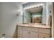 Bathroom with vanity, granite countertop, and large mirror at 1621 Edge Dr. # 3, North Myrtle Beach, SC 29582