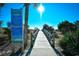 Wooden boardwalk leads to beach; sunny day at 200 S Ocean Blvd. # 3-B, North Myrtle Beach, SC 29582